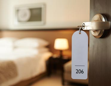 hotel-room-door-opening-to-reveal-bed-kenosha-wi