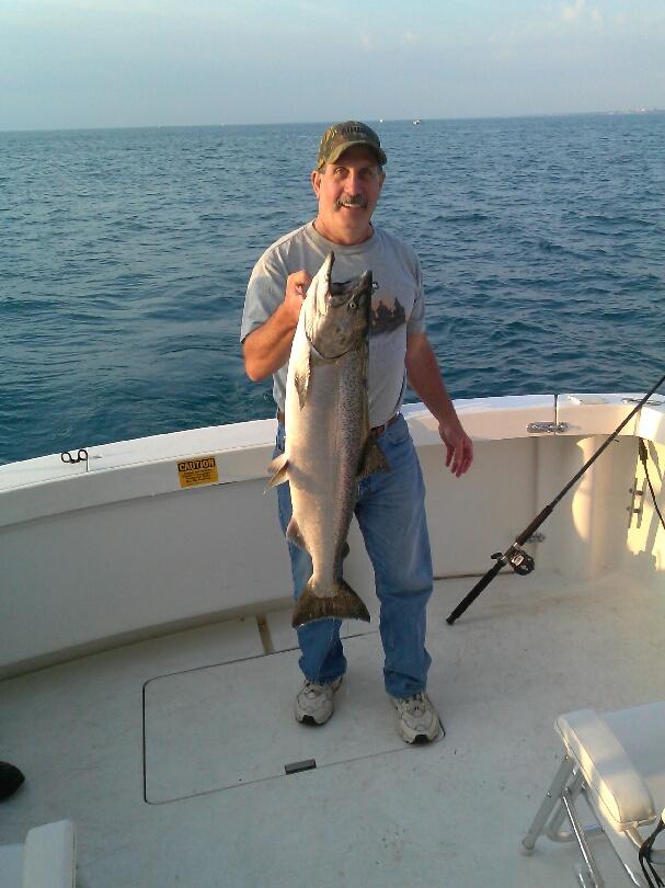 man-catching-fish-on-lake-michigan