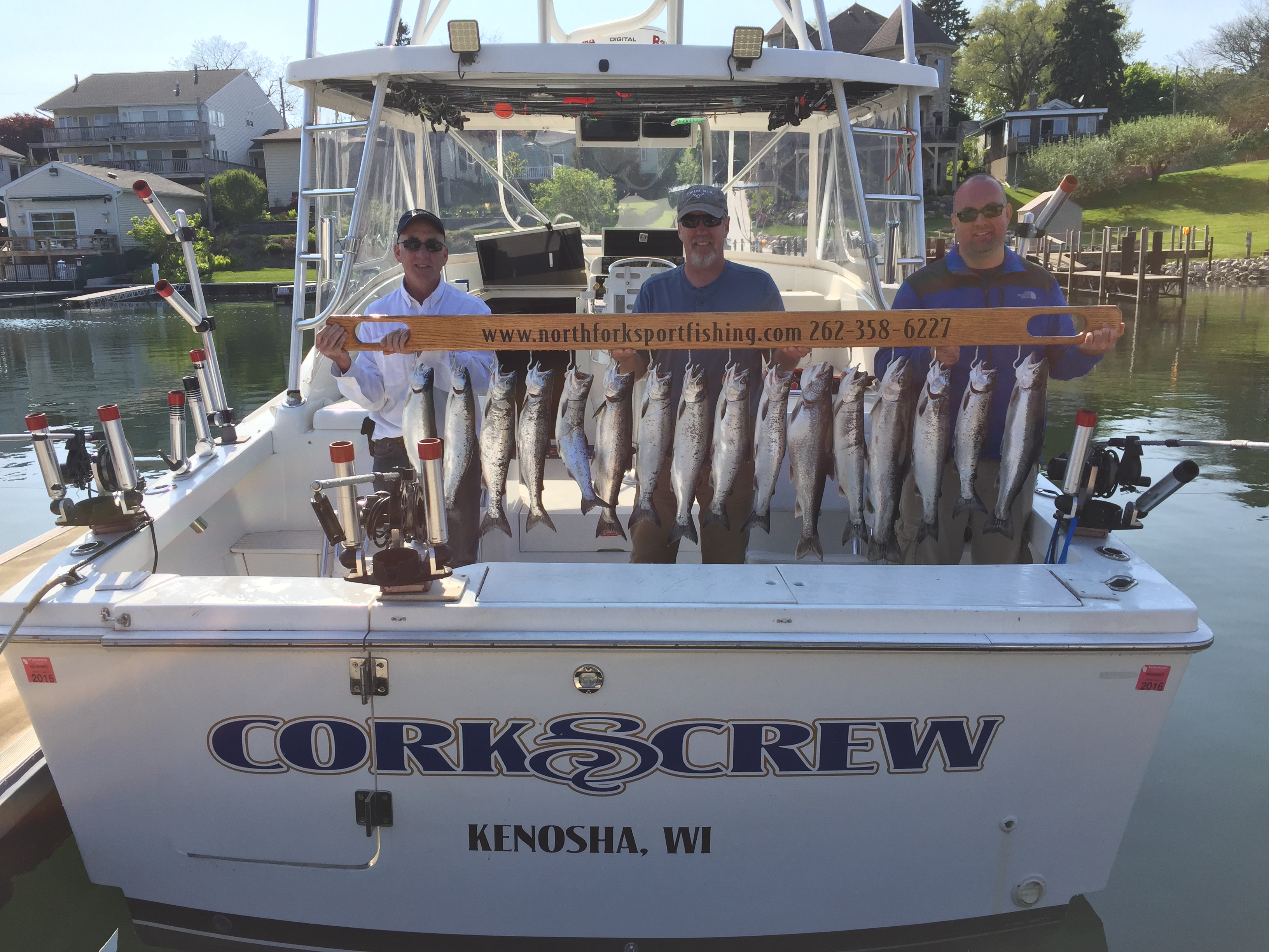 fish-caught-on-back-of-boat-with-3-men