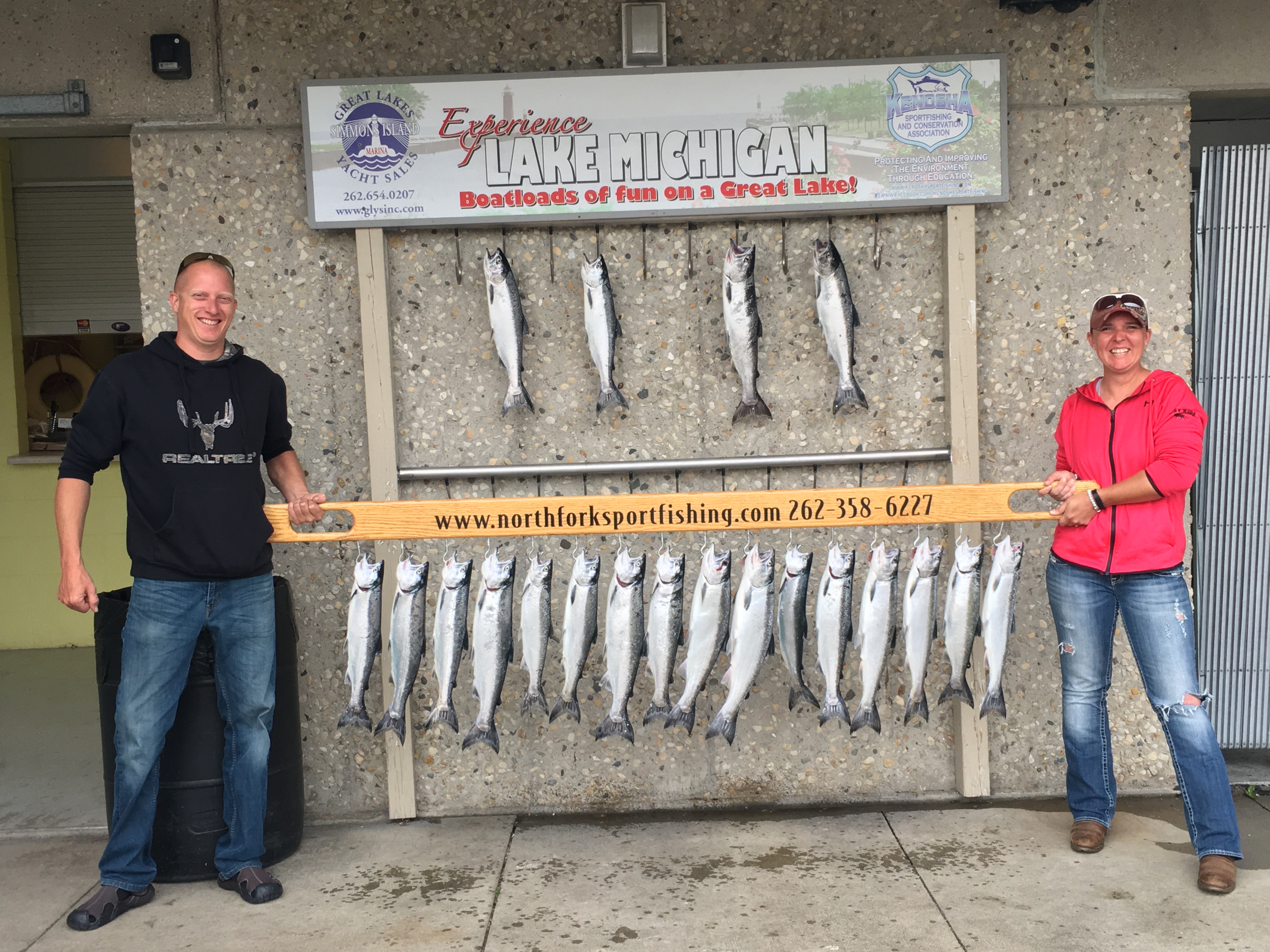 june-2017-man-and-women-show-their-trout-fishing-catch